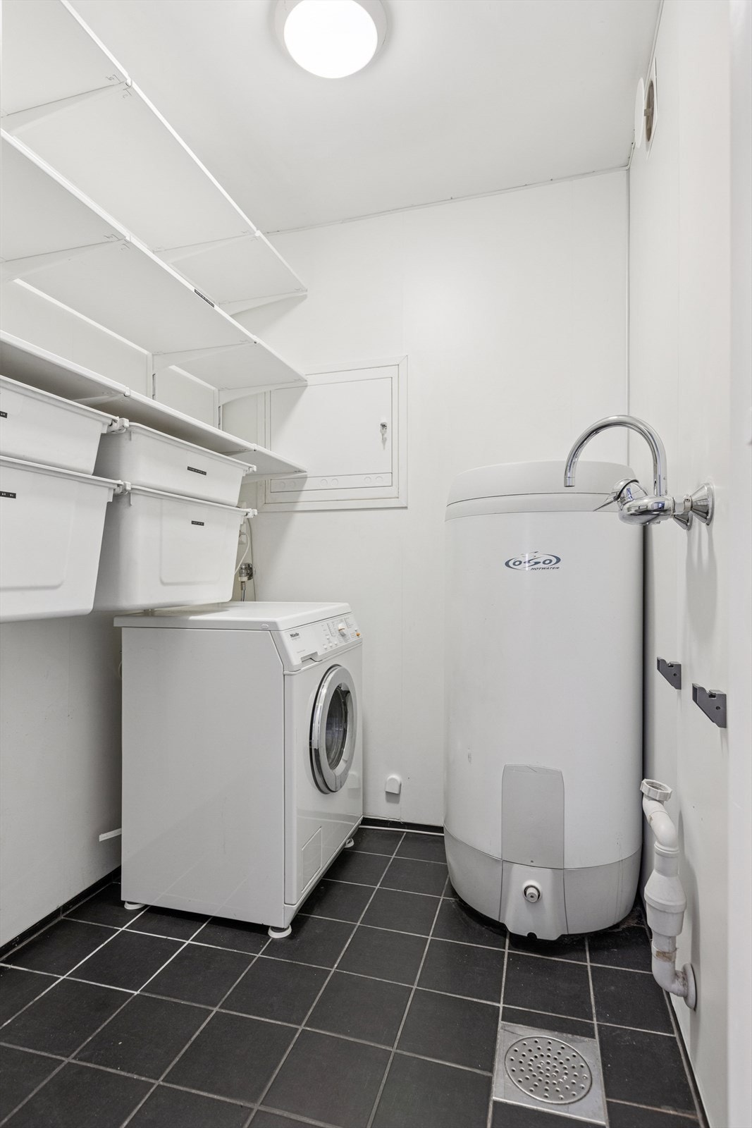 Leiligheten er også utstyrt med et særdeles praktisk vaskerom Galleribilde