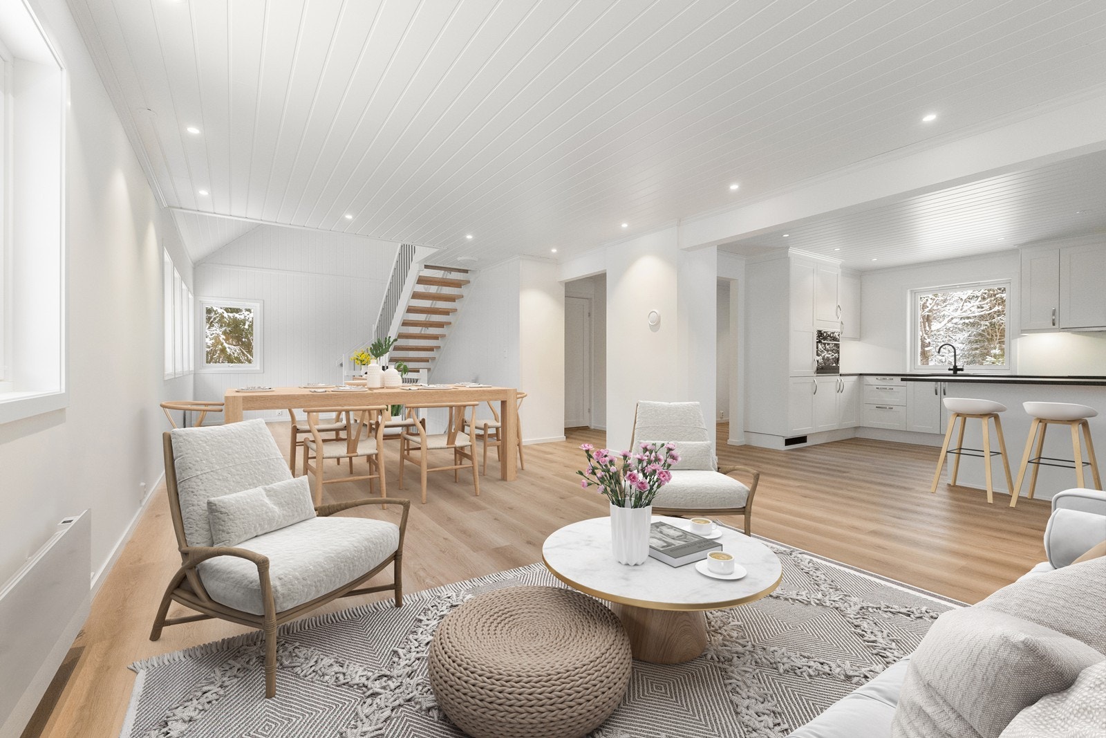 Flott kjøkken i åpen løsning til en lys stue i 1. etasje. (Bildet er digitalt stylet). Overflater ble oppgradert i 2024/25. Galleribilde