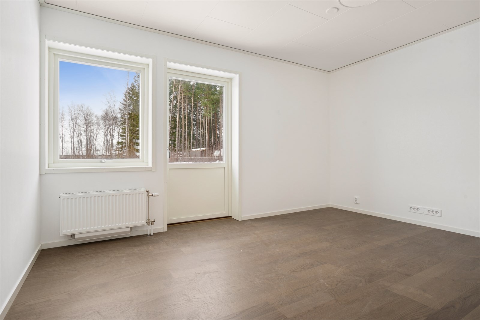 Stuen har delikate fargevalg ut direkte tilkomst til uteområdet Galleribilde