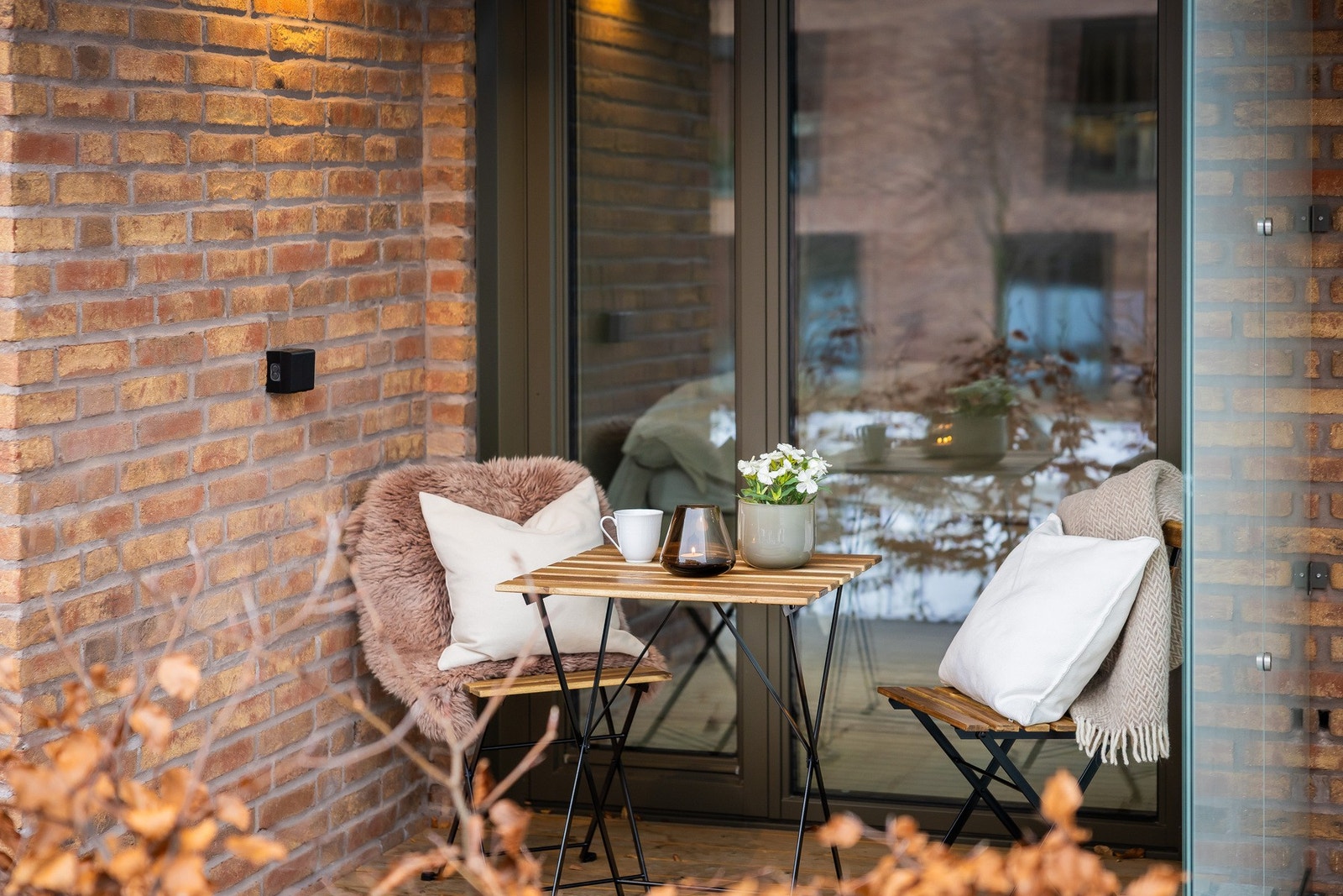 Markterrassen har en lun og hyggelig sittekrok. Galleribilde