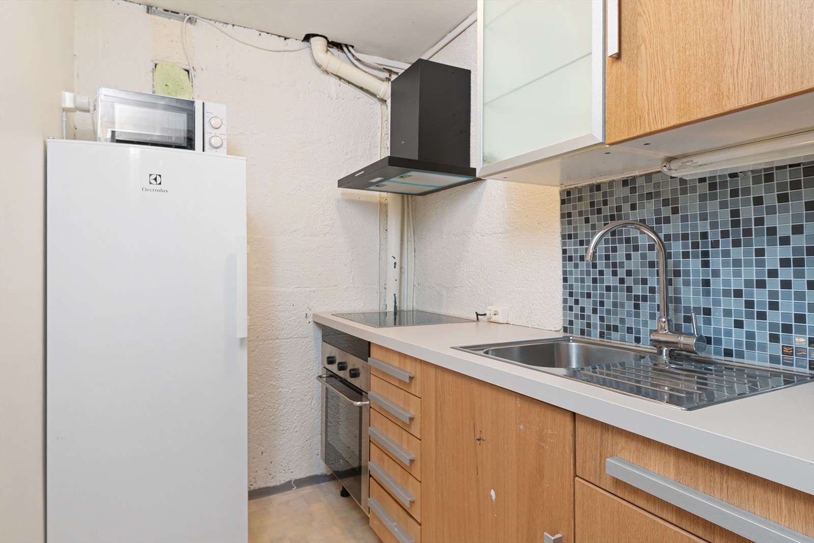 Kjøkken i kjeller (ikke godkjnet). Bod/garderobe i godkjente tegninger. Galleribilde