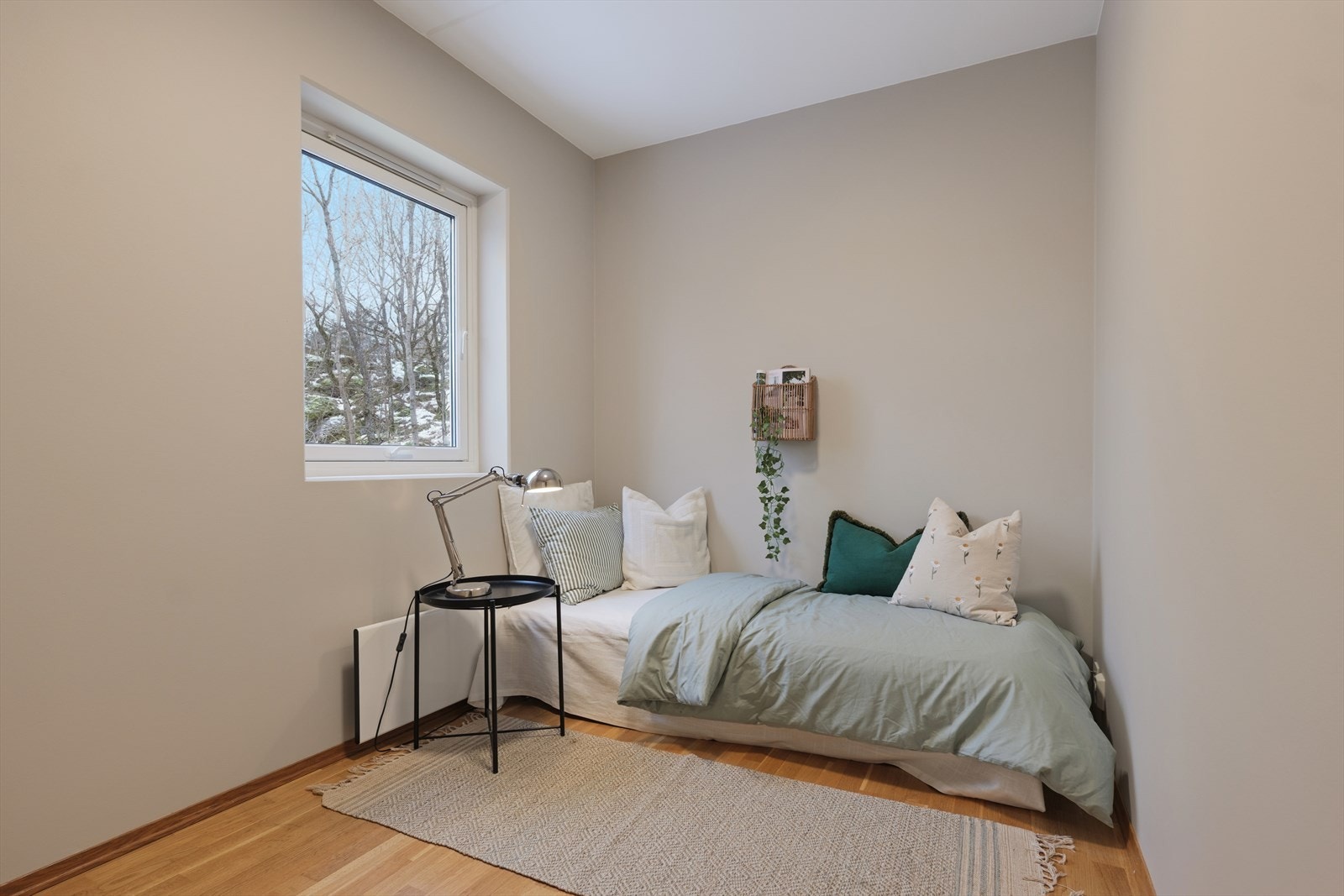 Leiligheten har også et koselig gjesteværelse Galleribilde