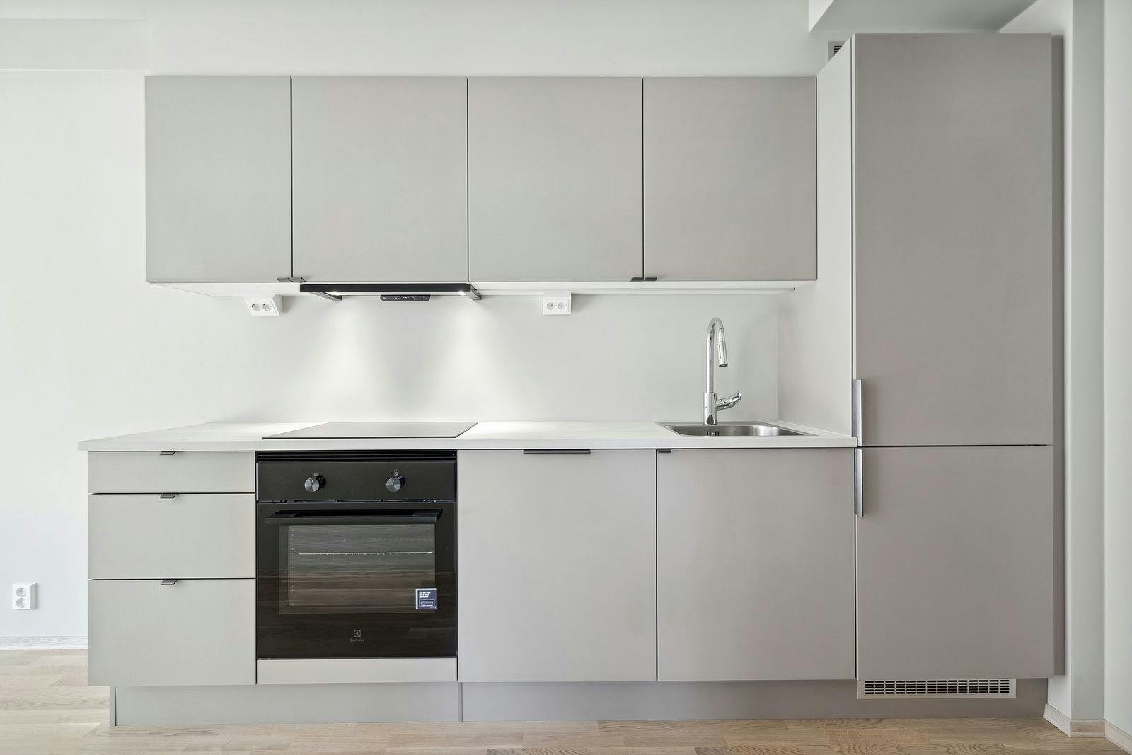 Flott og moderne kjøkken i moderne farge, samt integrerte hvitevarer. Galleribilde