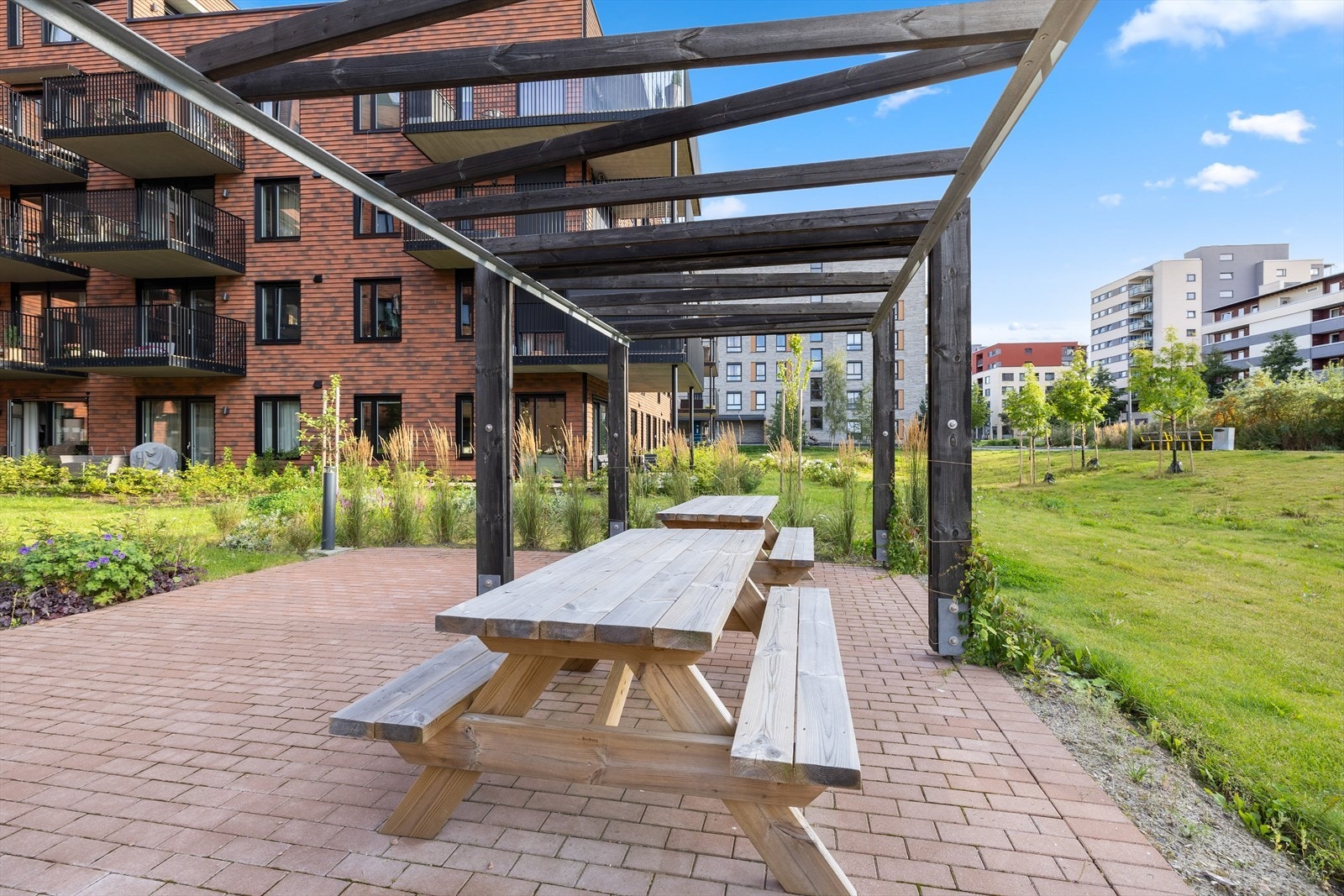 Koselige og skjermede sittegrupper i fellesarealene inviterer til sosialt samvær. Galleribilde