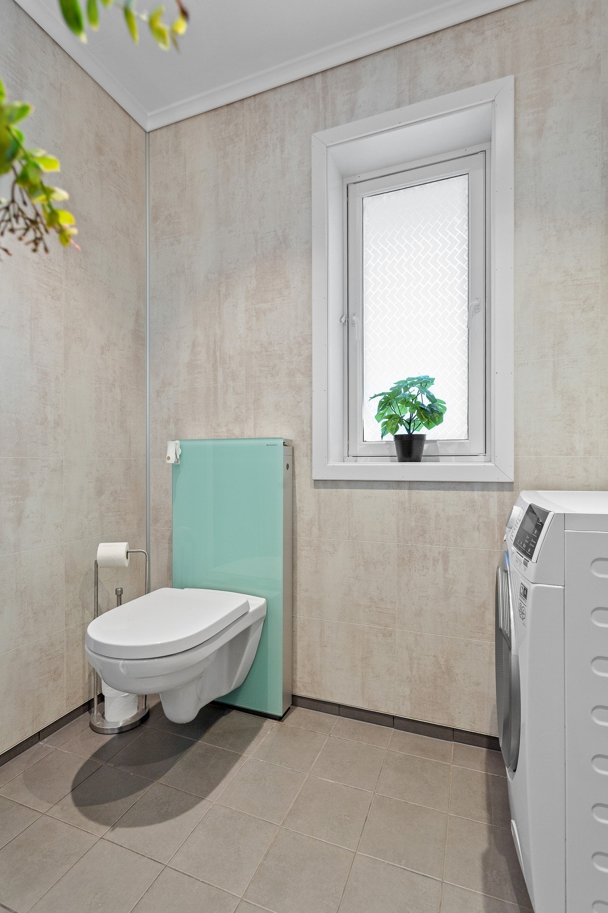 Badet har opplegg for vaskemaskin. Galleribilde