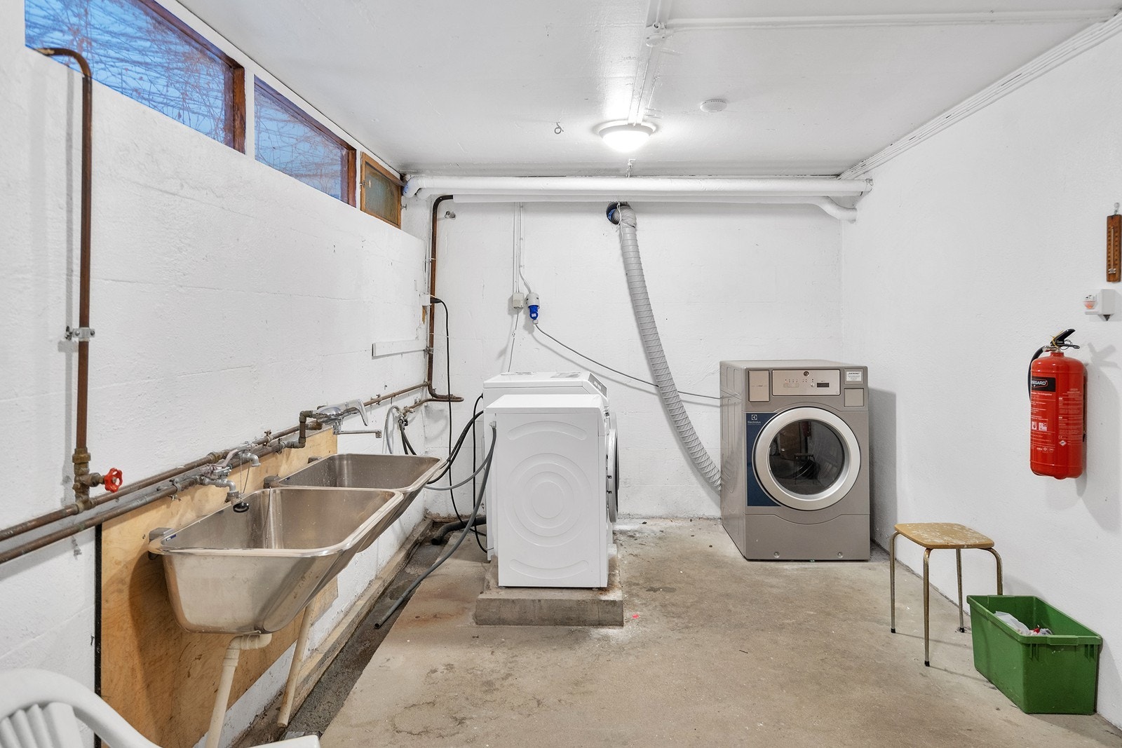 Det er tilgang på fellesvaskeri i kjelleren Galleribilde