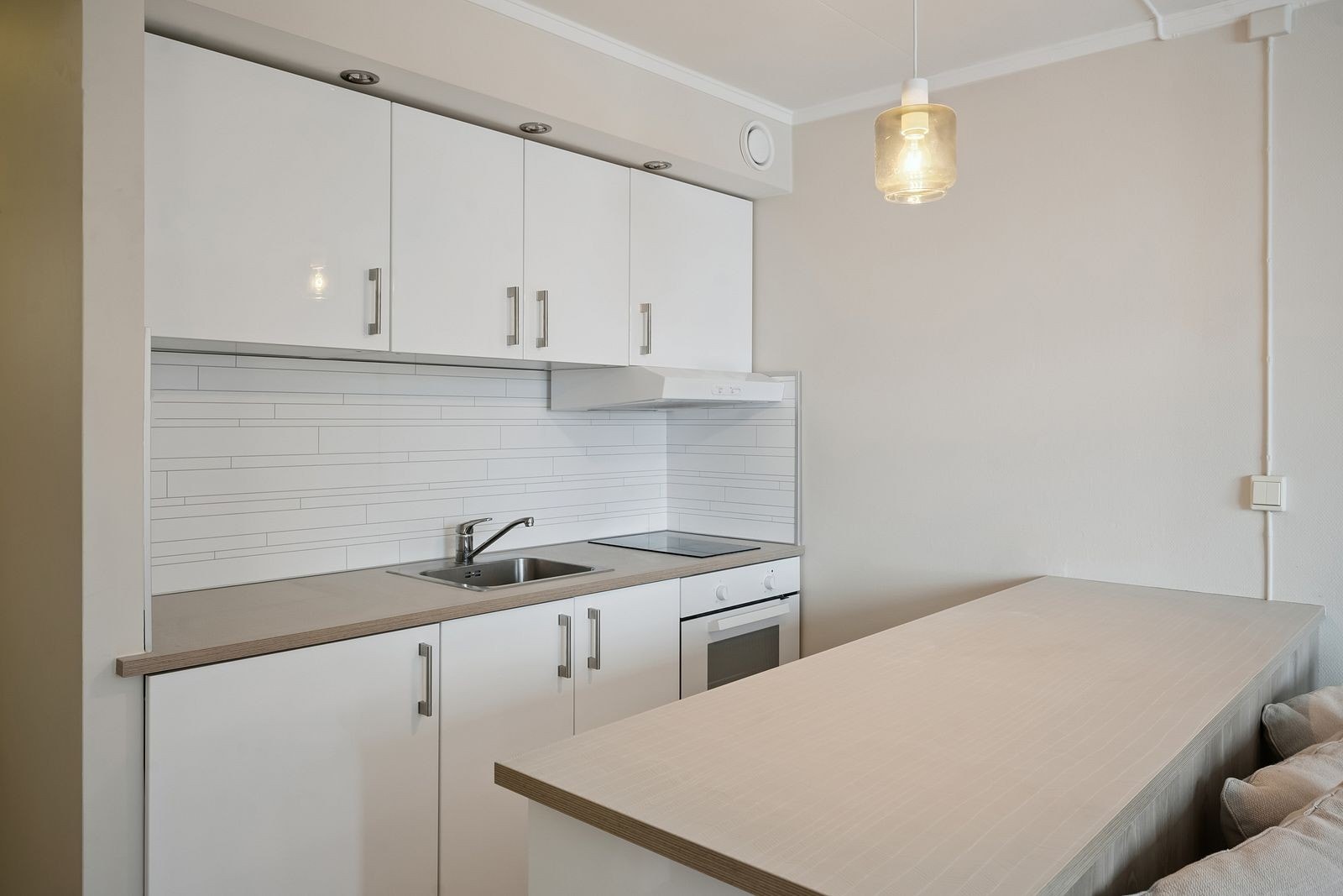 Integrerte hvitevarer gir en praktisk og funksjonell løsning. Galleribilde