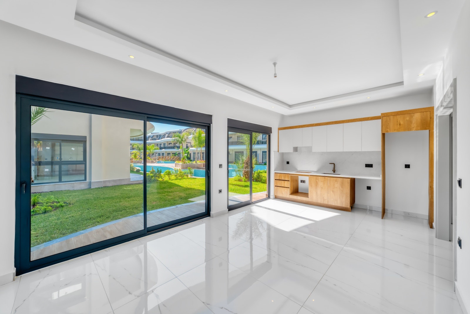 Living room with open plan kitchen Galleribilde