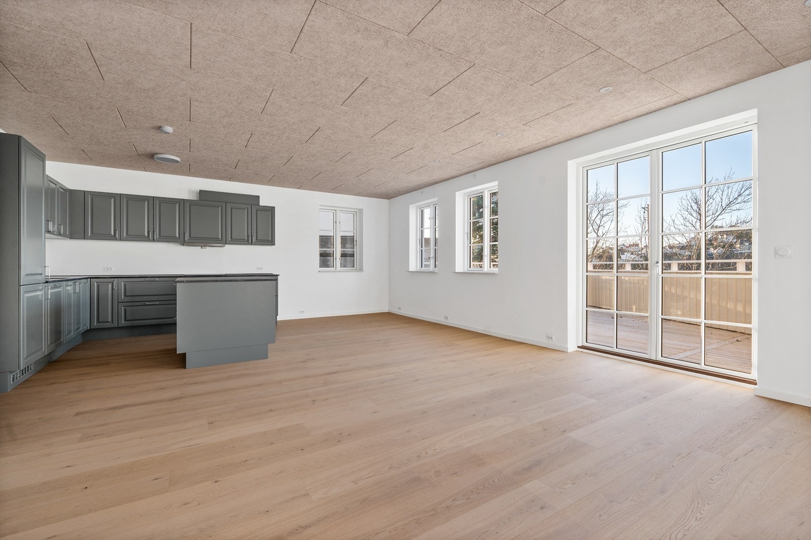 Stue og kjøkken i åpen løsning Galleribilde