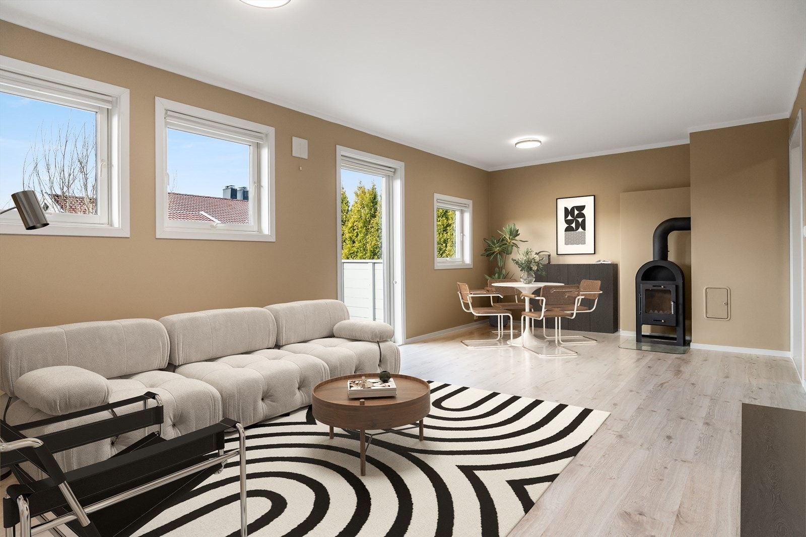 Lys og åpen stue i delvis integrert løsning med kjøkken, som gir en god og sosial romfølelse. Bildet er digitalt møblert Galleribilde