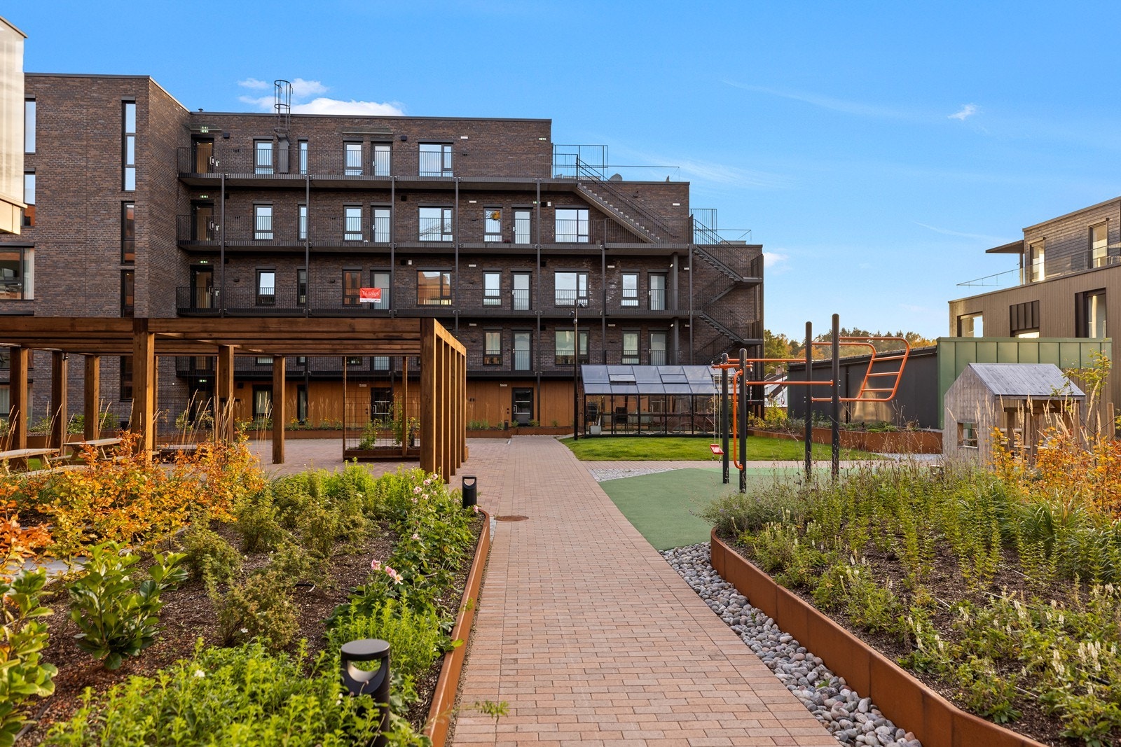 Fellesarealene inkluderer lekeplass for de minste. Galleribilde