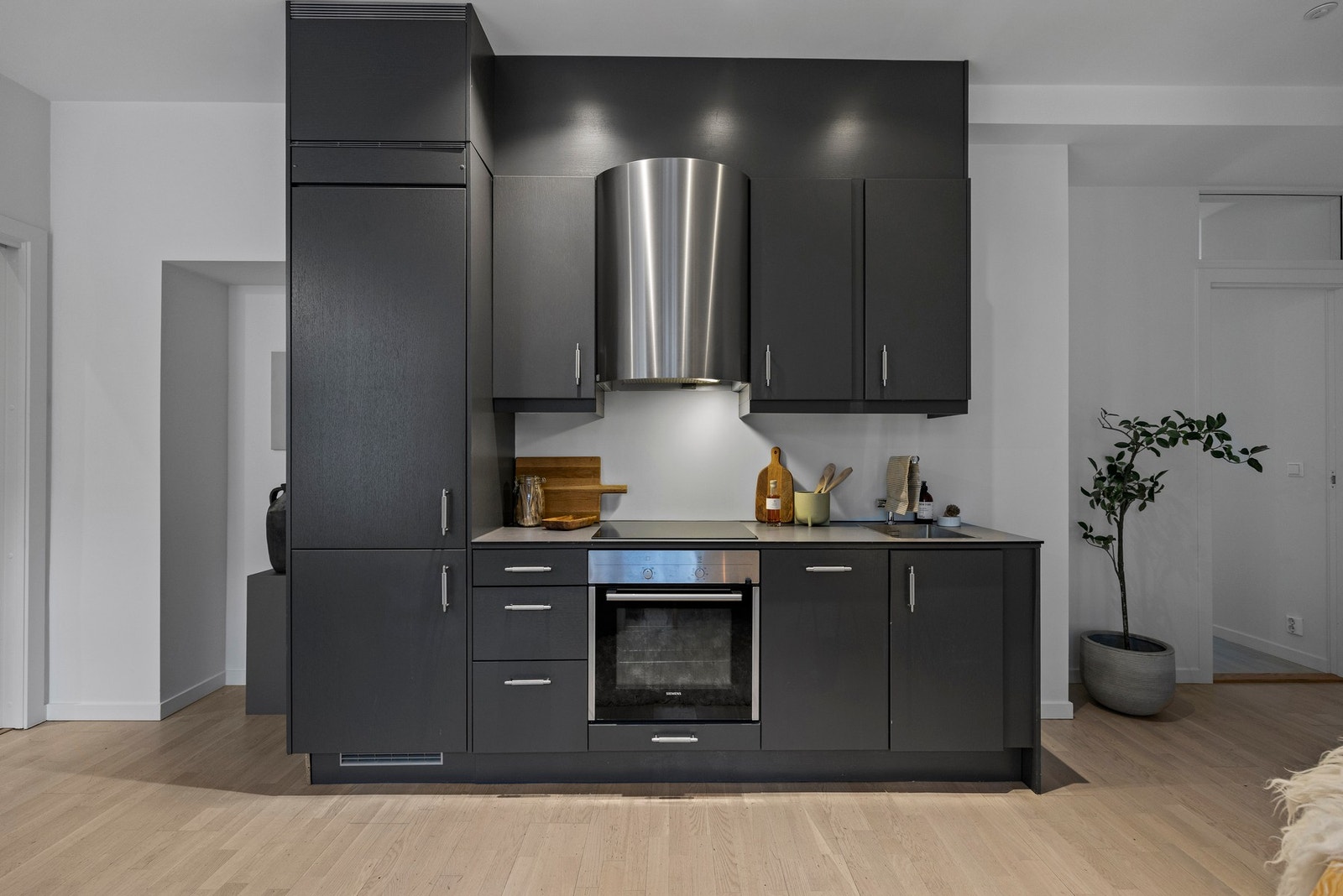 Innbydende, pent kjøkken fra Sigdal med glatte fronter. Galleribilde