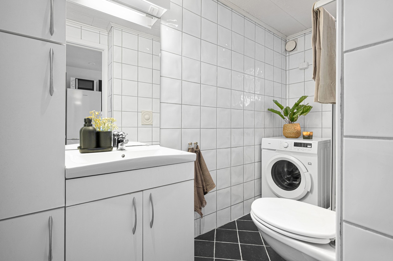 Badet har opplegg for vaskemaskin. Galleribilde