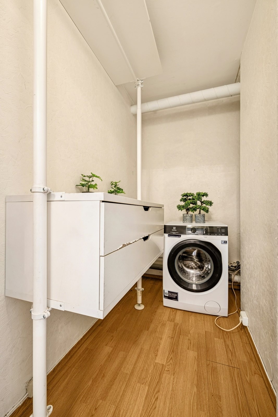 Boligen disponerer et romslig vaskerom. Galleribilde