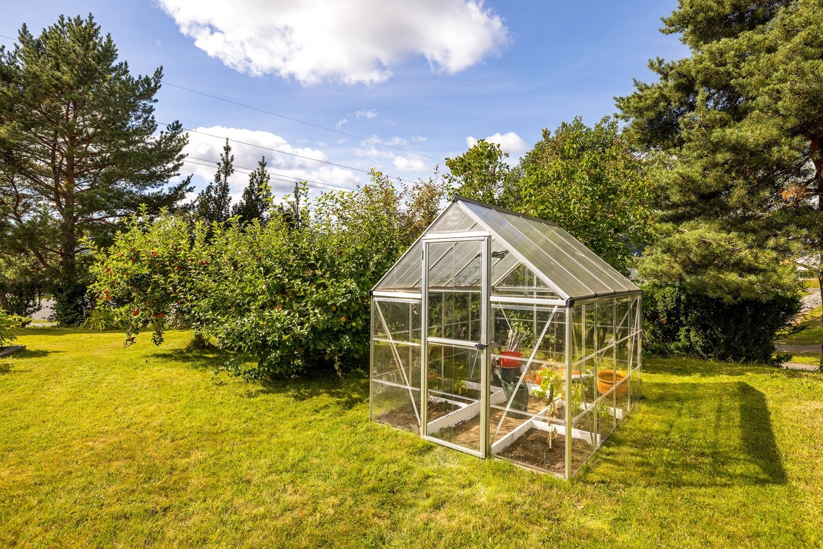 I hagen er det også et drivhus for den med grønne fingre. Galleribilde