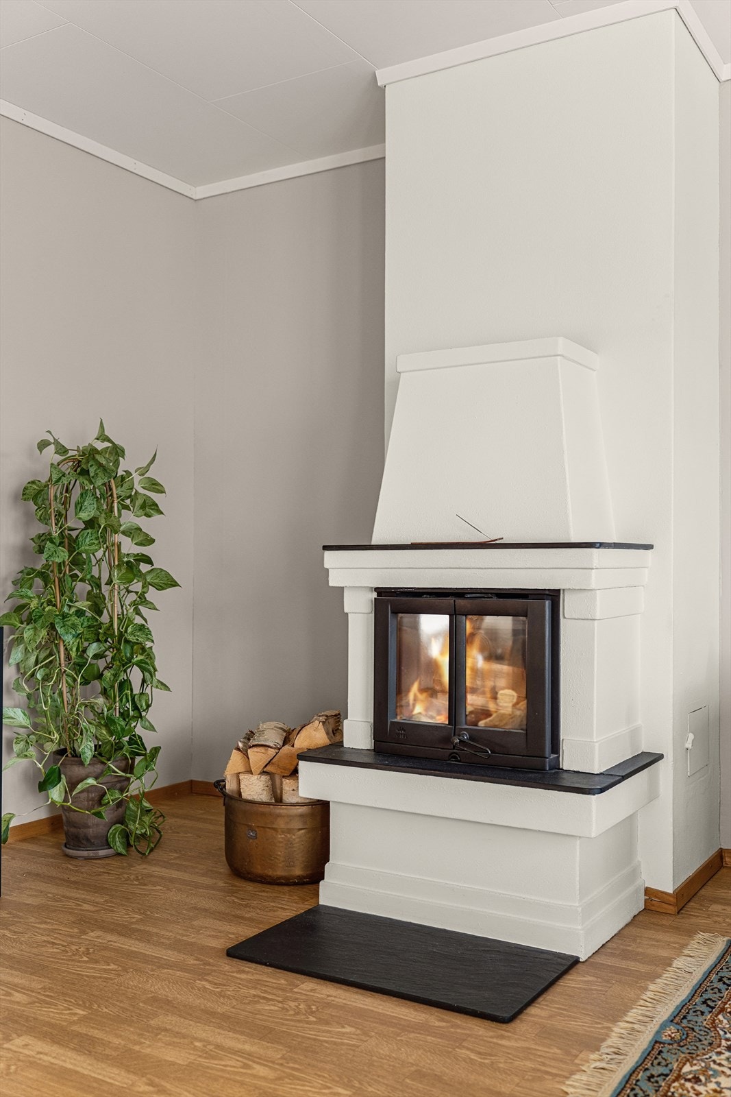 Den vakre peisen gir både varme og lun stemning Galleribilde