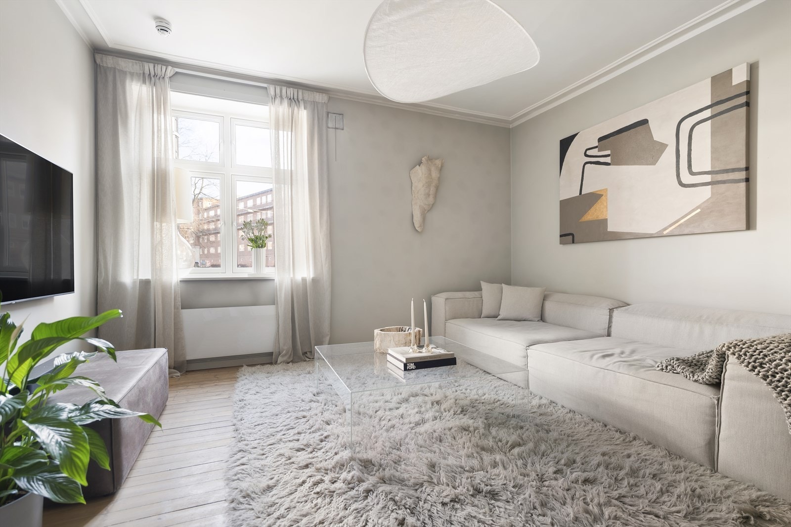 Leiligheten oppleves lun og hyggelig, men likevel lys og luftig. Galleribilde