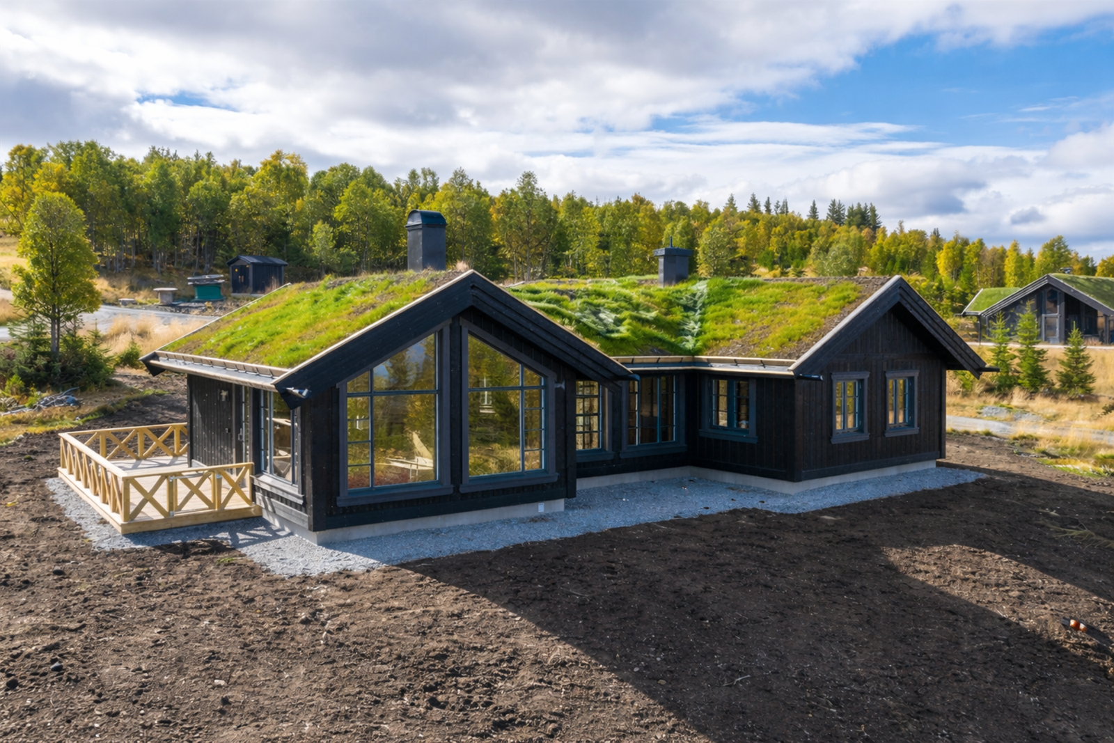 Sommerbilde av tilsvarende hytte. Galleribilde