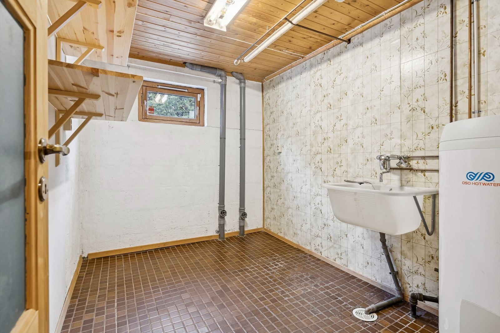 Et separat vaskerom i underetasjen forenkler klesvasken. Galleribilde