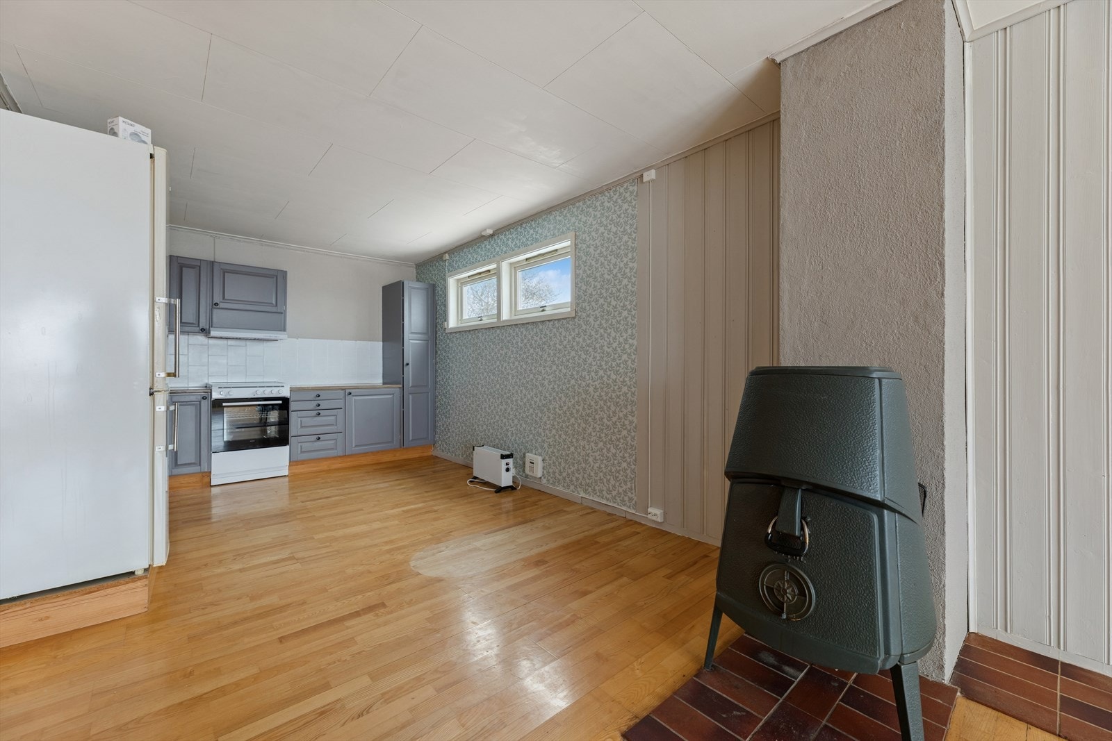 Den åpne løsningen skaper en sosial sone mellom kjøkkenet og stuen. Galleribilde