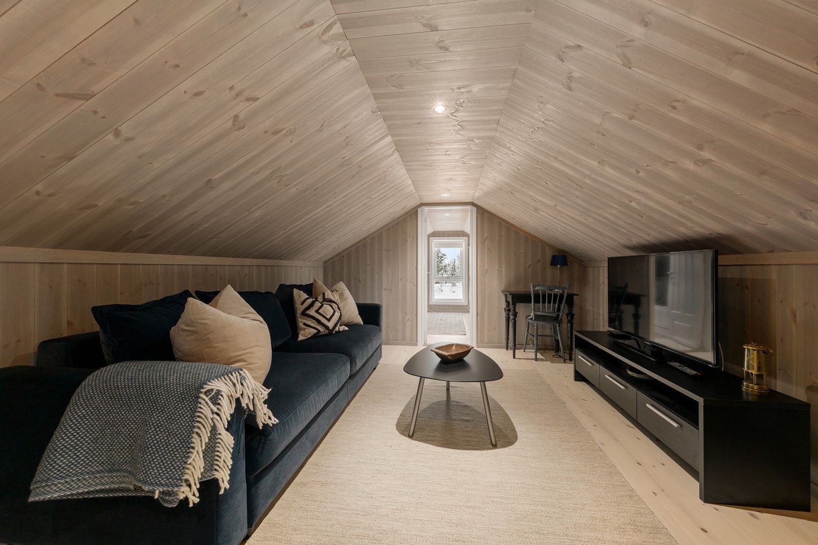 Med sine lune omgivelser gir stuen en koselig atmosfære for hele familien. Galleribilde