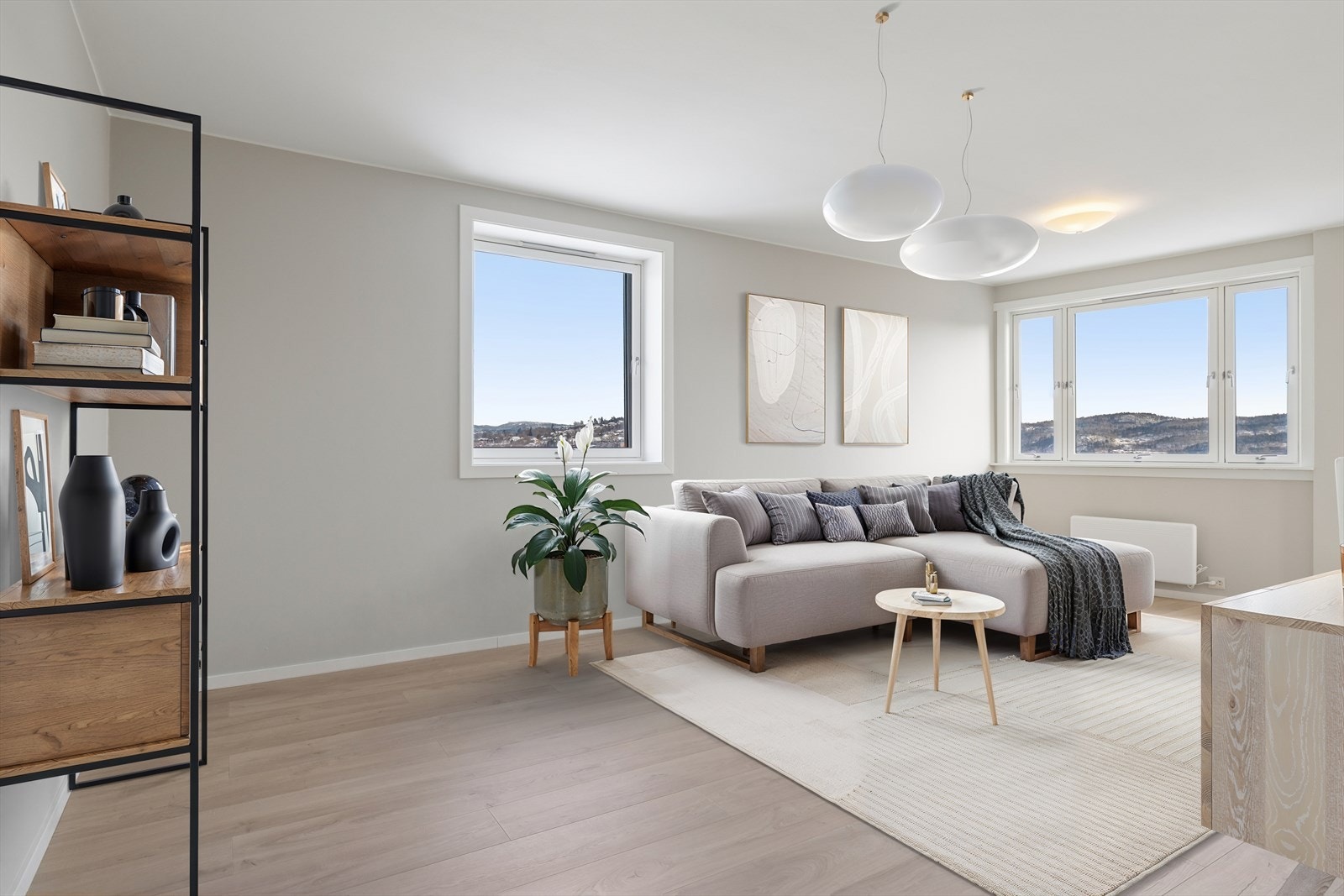 Dette er en tiltalende og nyoppusset topp- og hjørneleilighet, beliggende høyt og fritt i 12. etasje. Bildet er digitalt stylet. Galleribilde