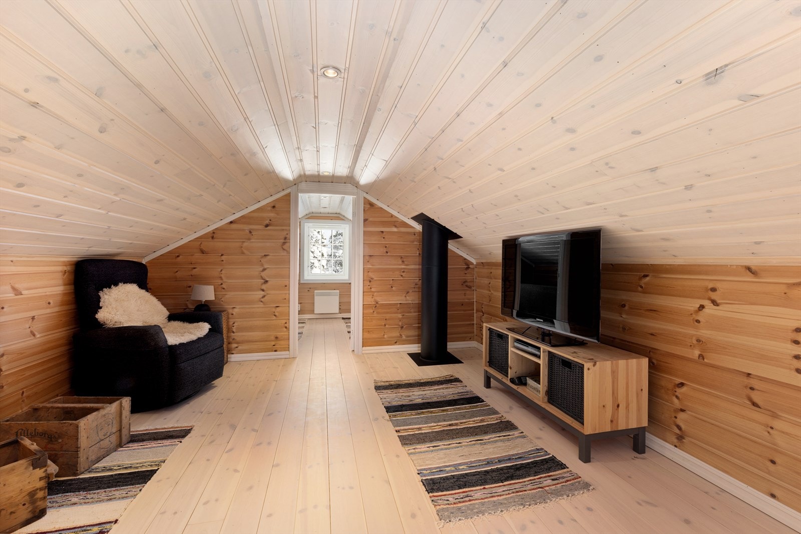 Med sine lune omgivelser gir stuen en koselig atmosfære for hele familien. Galleribilde