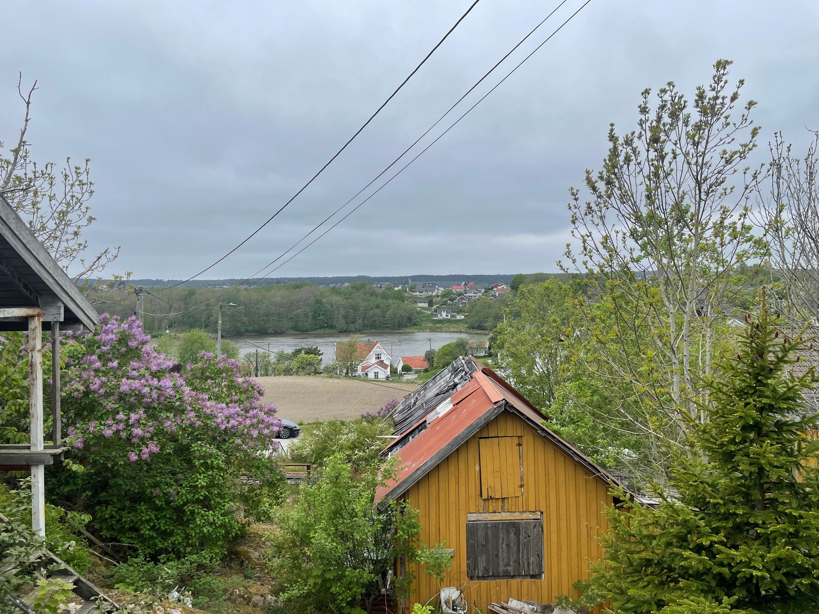 Utsikt fra tomten vestover mot elven og Rolvsøy Galleribilde