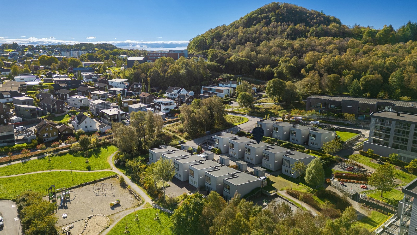 Her blir du en del av et svært trivelig nabolag, med et yrende liv i gatene og på fellesområdene. Galleribilde