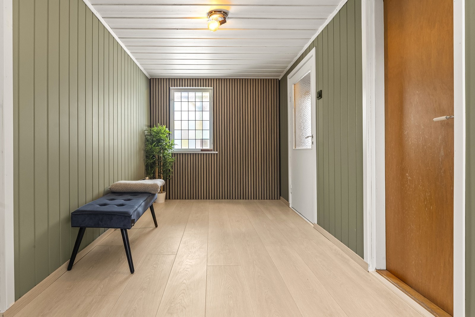 Vindfanget i underetasjen ønsker velkommen med oppgraderte overflater. Galleribilde