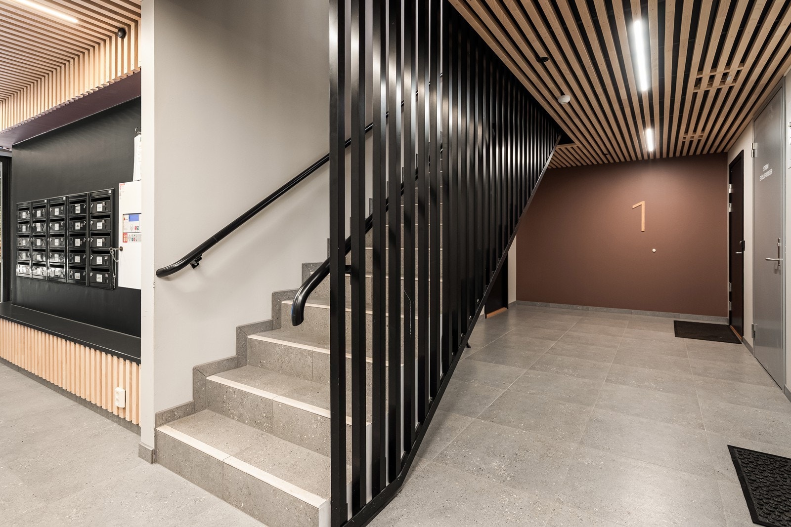 Felles inngangsparti er representativt med moderne materialvalg. Galleribilde