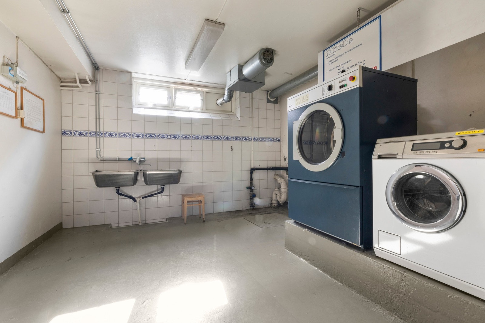 Borettslaget har fellesvaskeri som kan brukes av beboerne Galleribilde