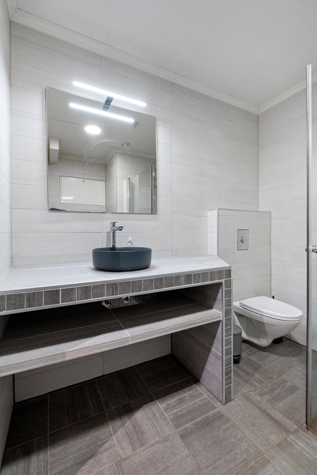 Flislagt bad med gulvvarme Galleribilde