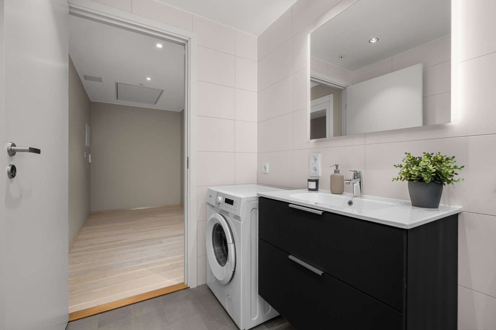 Badet har opplegg for vaskemaskin. Galleribilde