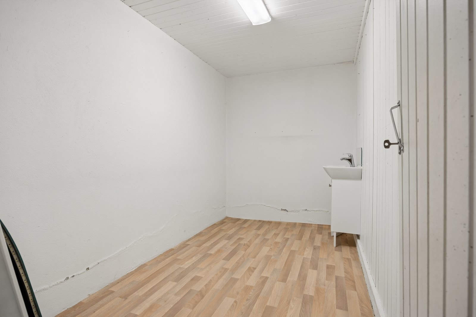 Det andre uinnredede kjellerrommet gir ytterligere lagringsplass. Galleribilde