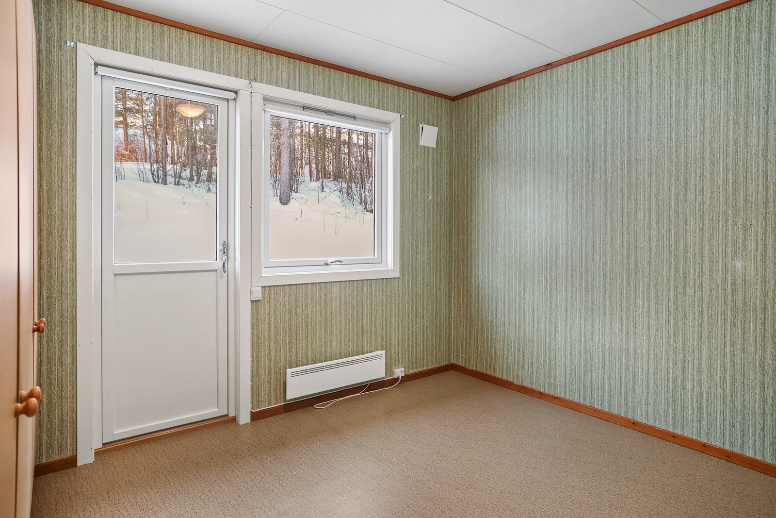 Fra dette soverommet er det utgang til en trivelig terrasse. Galleribilde