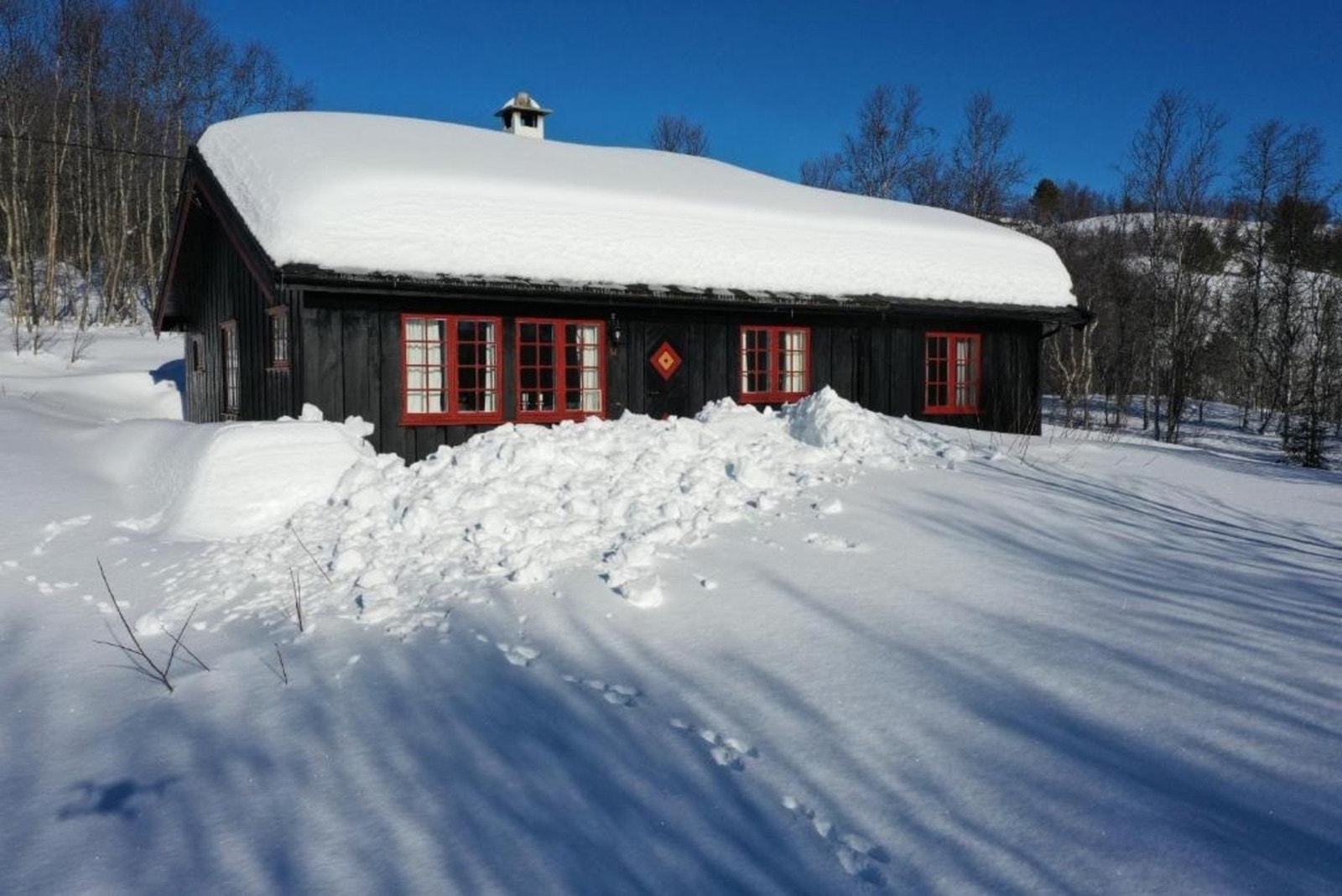 Lekker laftehytte på Geilo presenteres av Erik Mortensen i Eiendomsmeglerne AS Galleribilde