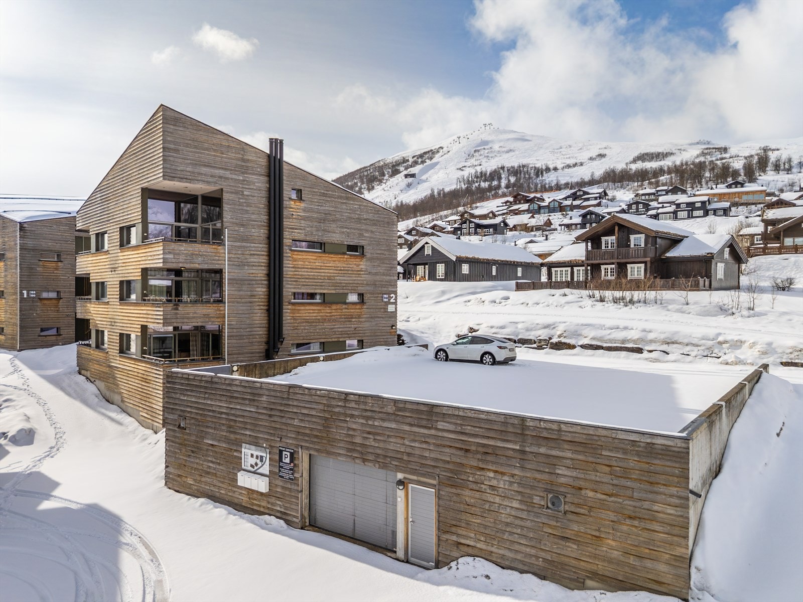 Parkeringsareal kloss ved leiligheten Galleribilde