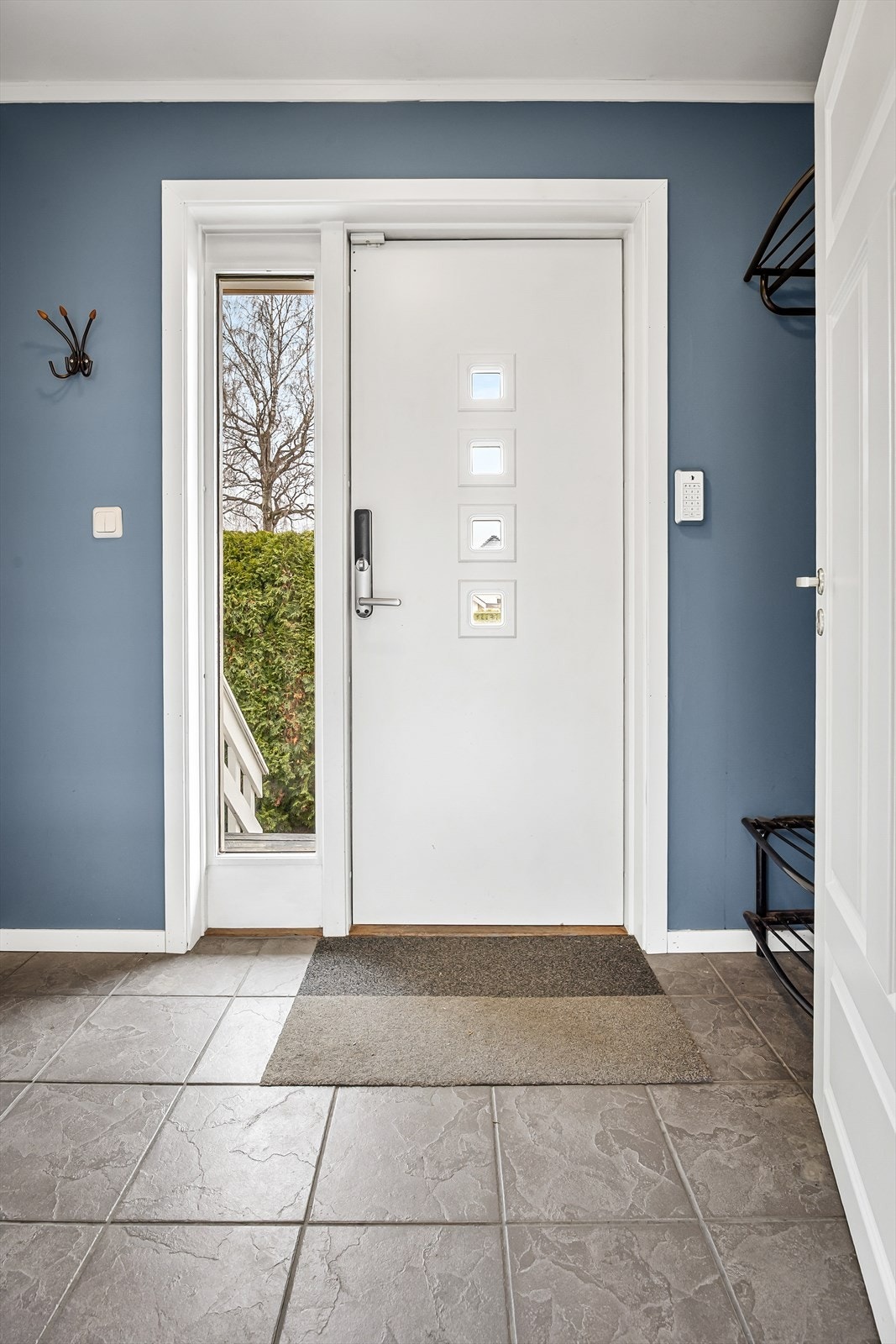 Entré med fliser på gulv med gulvvarme Galleribilde