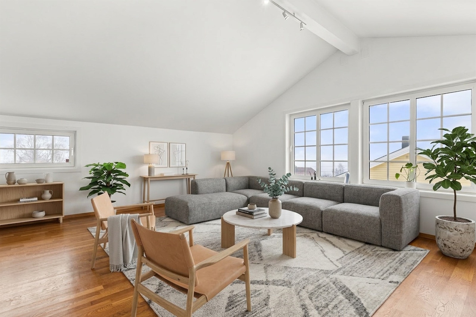 De store oppholdsrommene i boligen gir god plass til både familieliv og gjester. (Bildet er rendert med AI.) Galleribilde