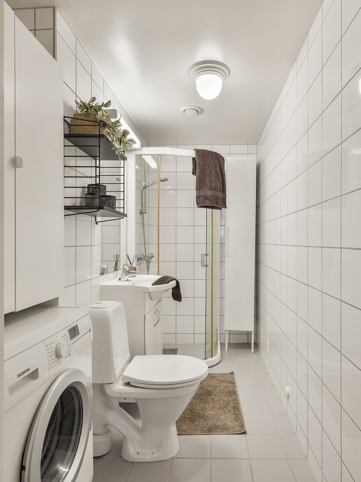 Flislagt bad med gulvvarme for økt komfort. Galleribilde