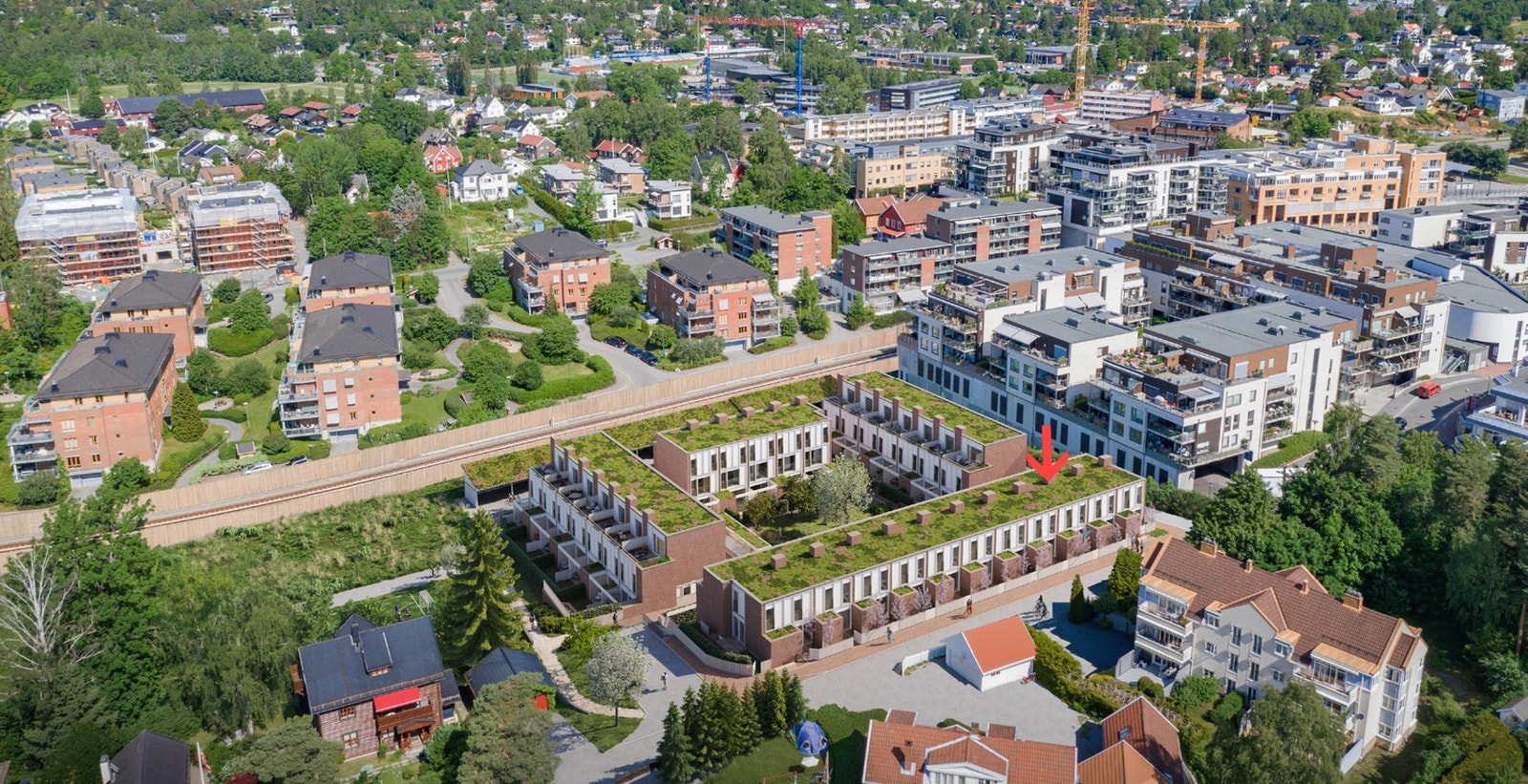 Oversiktsbilde av prosjektet. Bolig A-3 er merket med pil. Illustrasjonsbilde fra prosjektets salgsoppgave Galleribilde