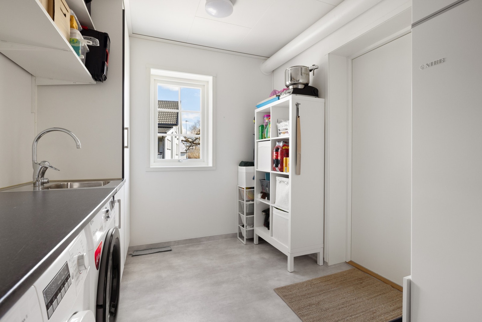 Eget vaskerom hvor varmesentral er plassert. Galleribilde