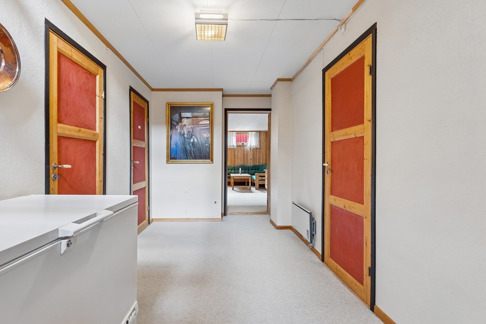 Gang i kjelleretasjen forbinder de ulike rommene. Galleribilde