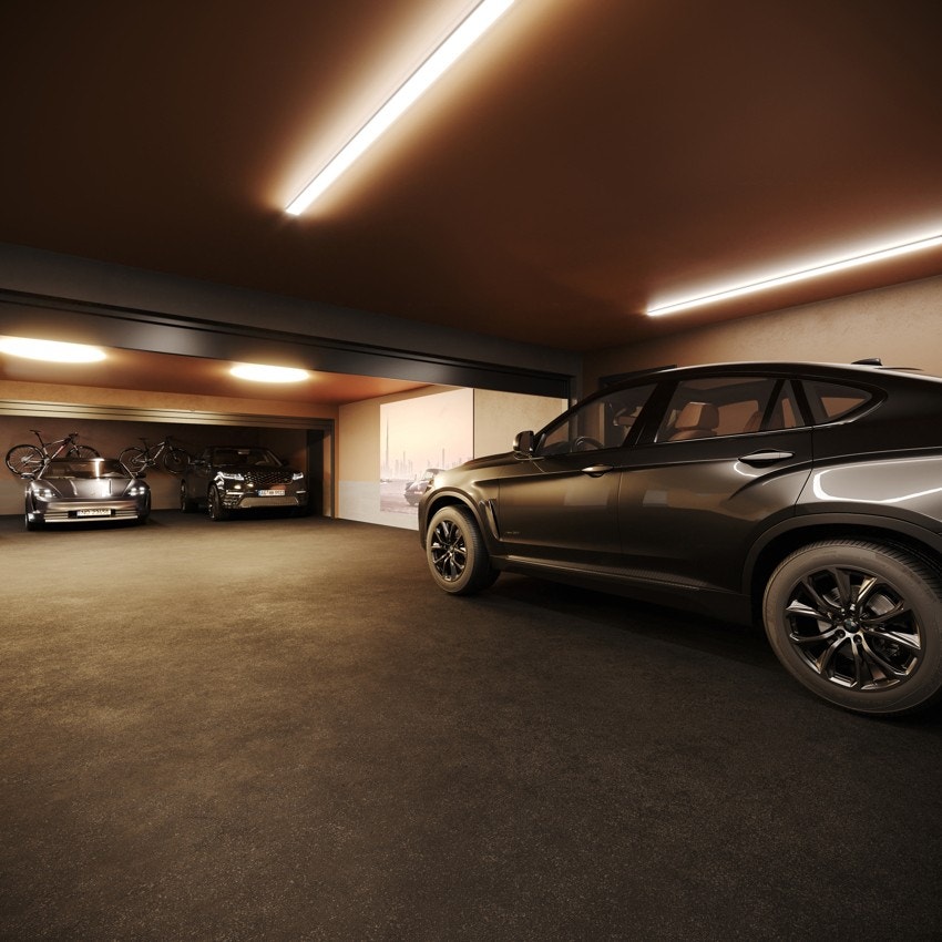 Hver enhet har to private parkeringsplasser med heis fra garasjeplan opp til leiligheten. Ditt eget parkeringsareal avlukkes med fjernstyrte heve/senkeporter. Galleribilde