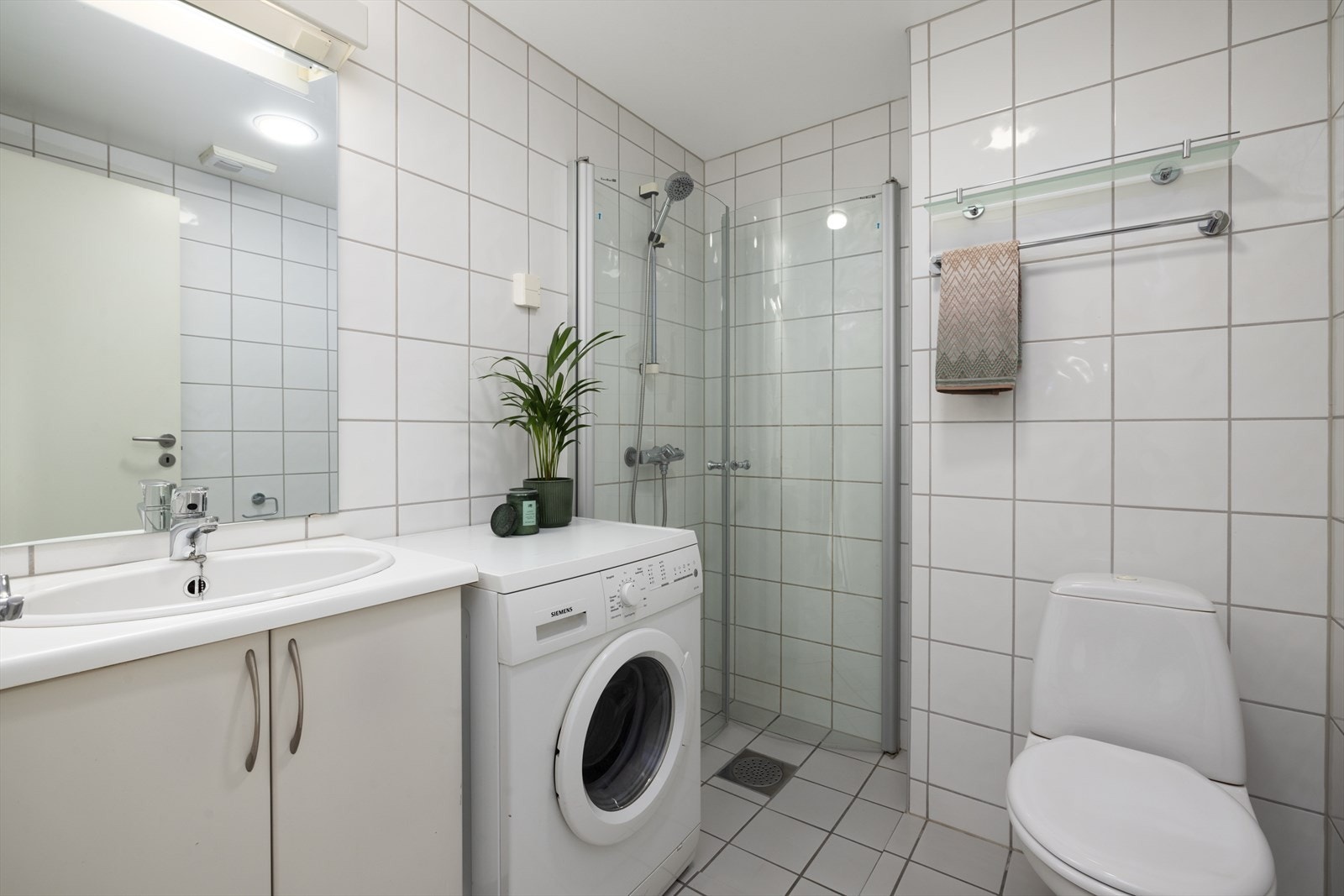 Flislagt bad med gulvvarme. Galleribilde