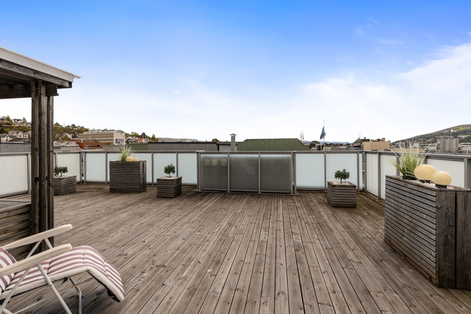 Beboerne har tilgang til en felles, solrik takterrasse Galleribilde