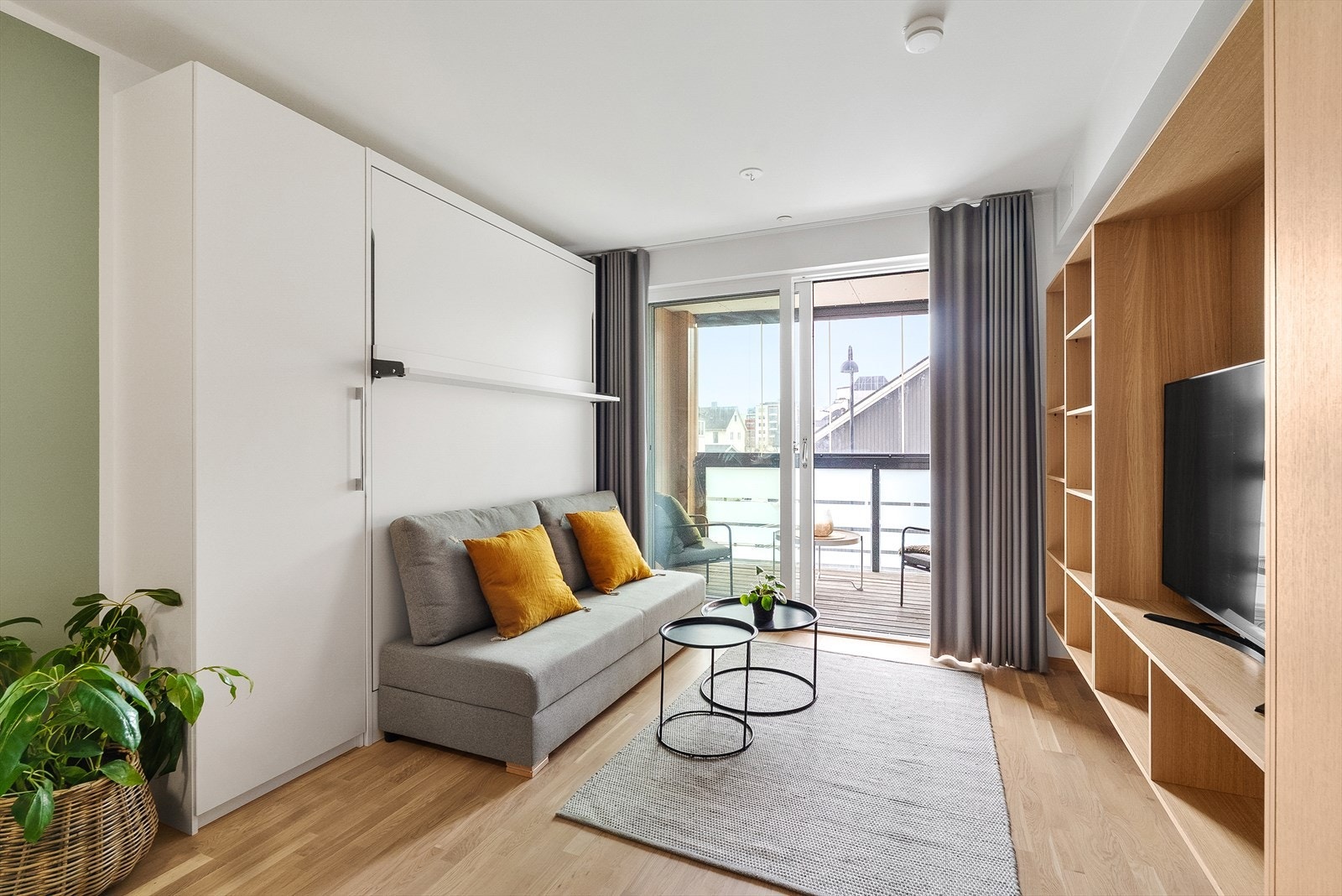 En stilren og smart studioleilighet med innglasset balkong og utsikt! Galleribilde