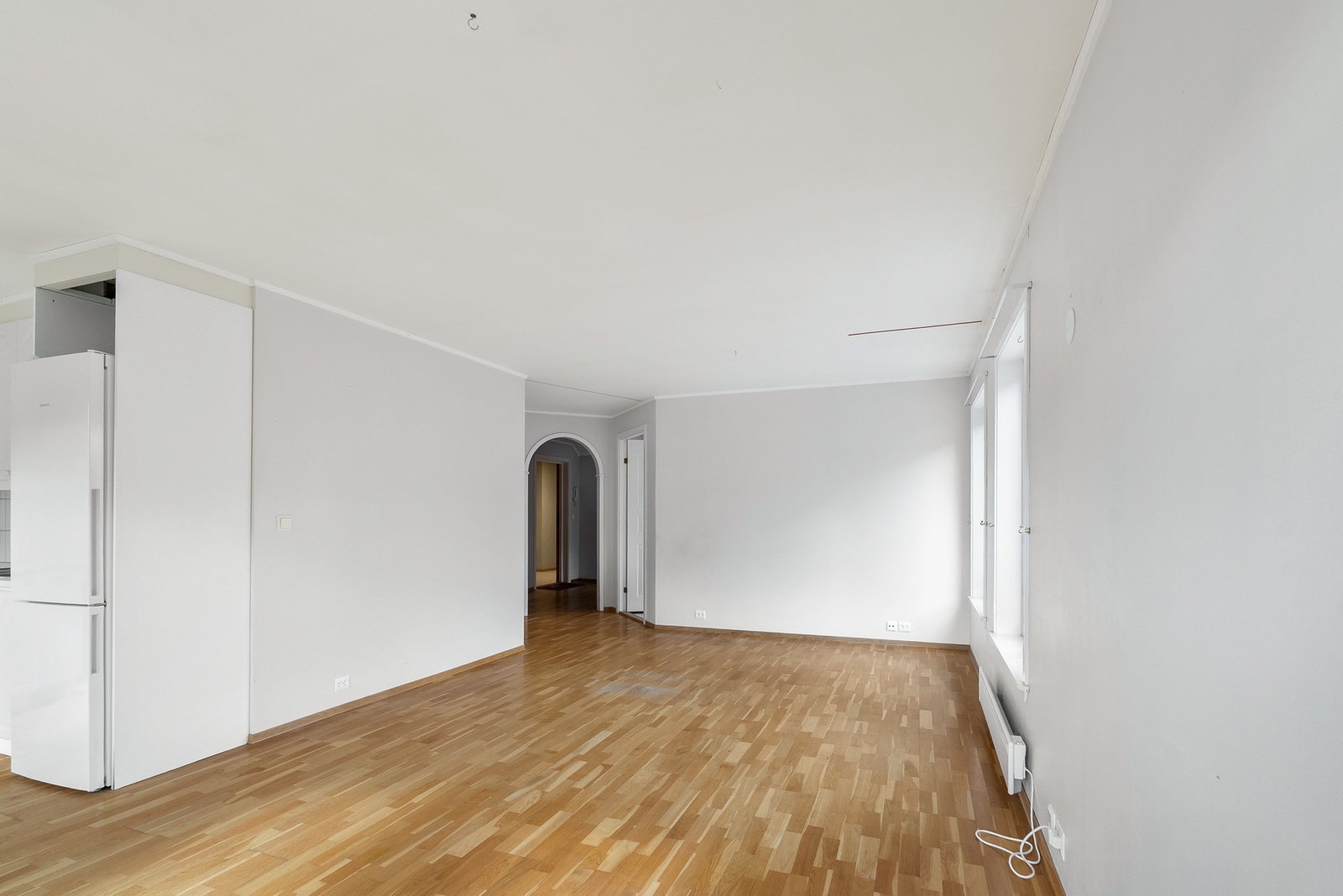 Fra stuen er det en buet åpning inn mot gangen som leder til soverommene og badet. Galleribilde