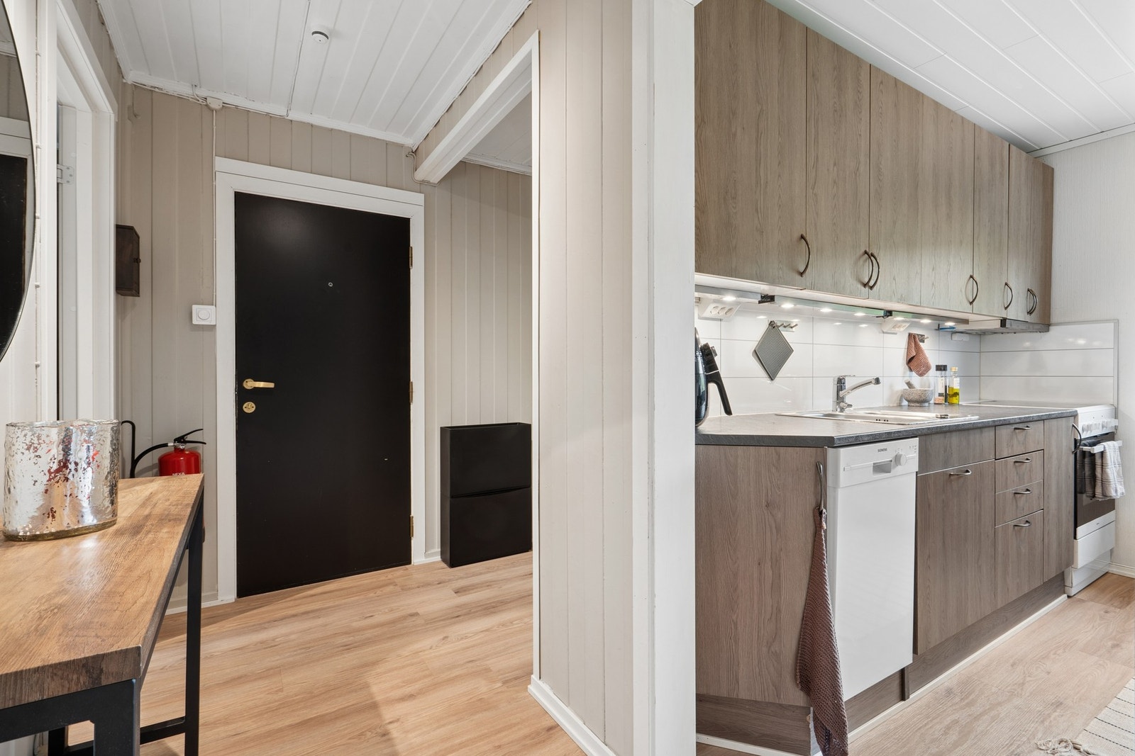 Gangen leder videre inn mot kjøkken og stue. Galleribilde